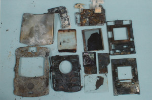 Exhibit-412-Burnt-Cell-Phone-Pieces-1024x674